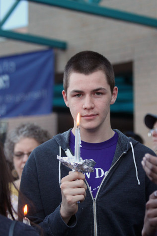 Community participates in anti-protest gathering and candlelight vigil walk in honor of shooting victims