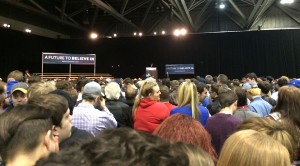 The crowd surrounding the empty stage waits for Sanders to come onstage.