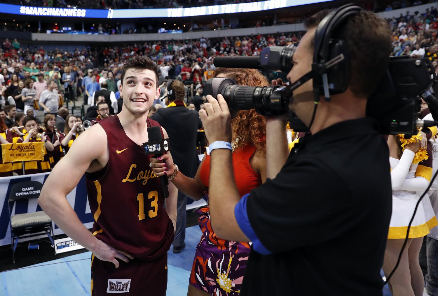 Custer talks to Rosalyn Gold-Anwude of TNT after his game-winner against Tennessee in the second round.